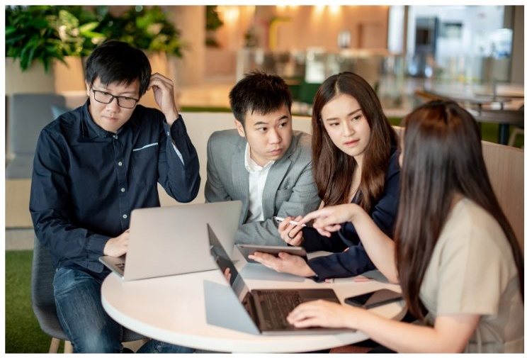 Founders collaborating in a global business meeting
